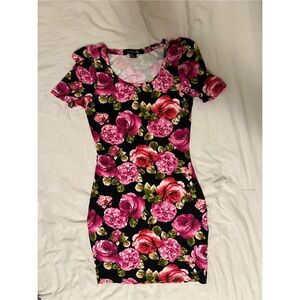 Black and pink floral bodycon dress with short sleeves and a round neckline